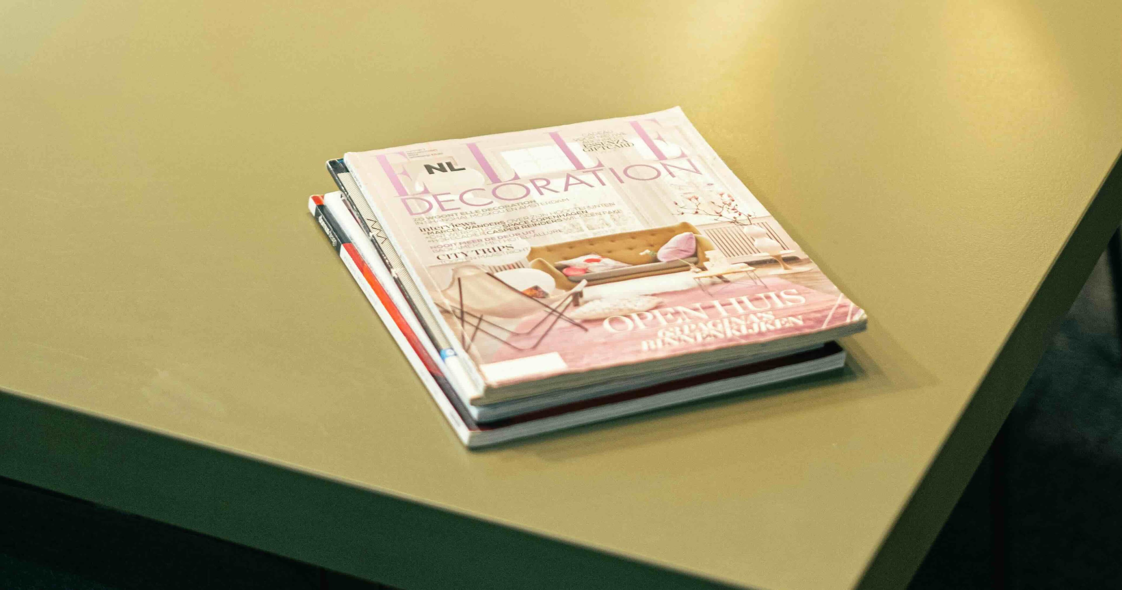Stack of magazines representing recurring subscription charges