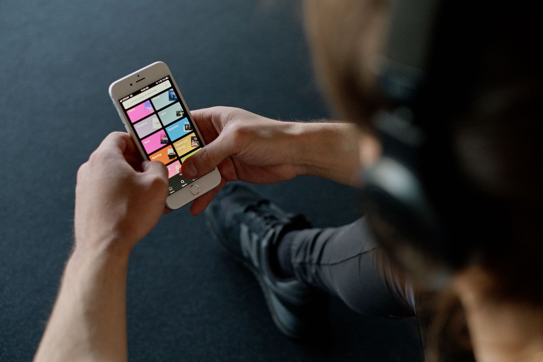 Person reviewing monthly bills and recurring charges on a smartphone budgeting app