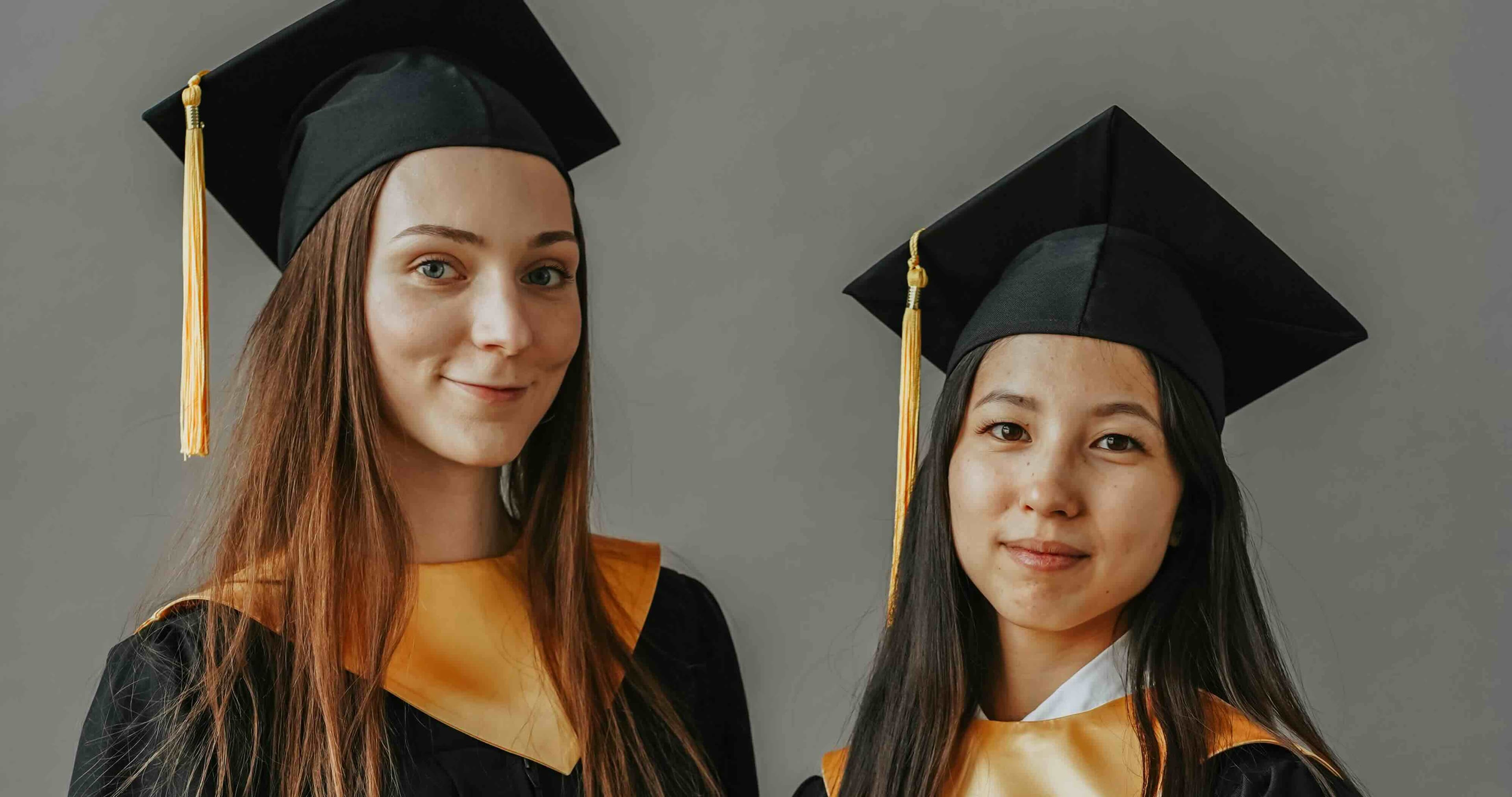 College graduates celebrating in caps and gowns