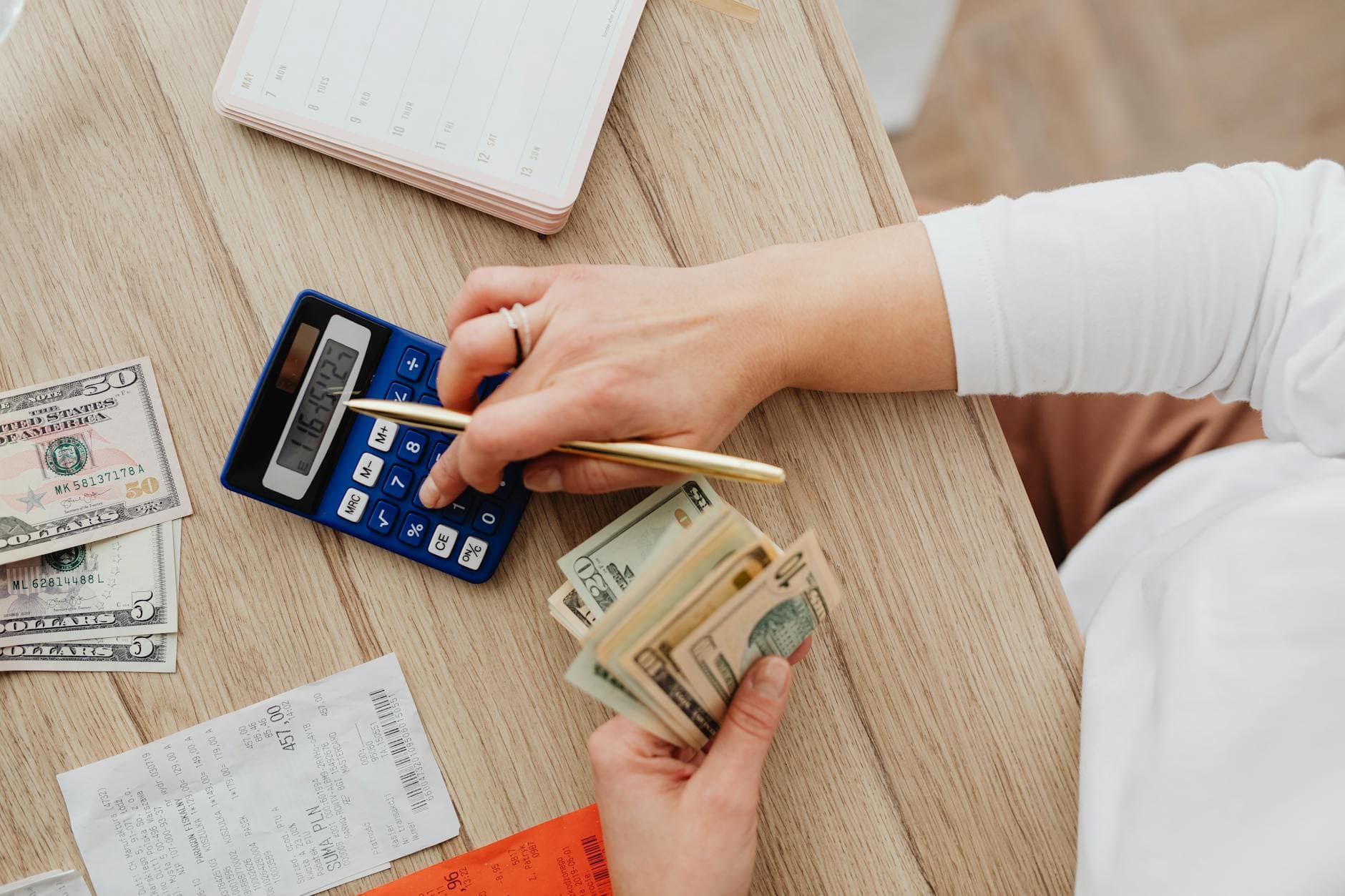 Person reviewing AI-powered budgeting app on a smartphone