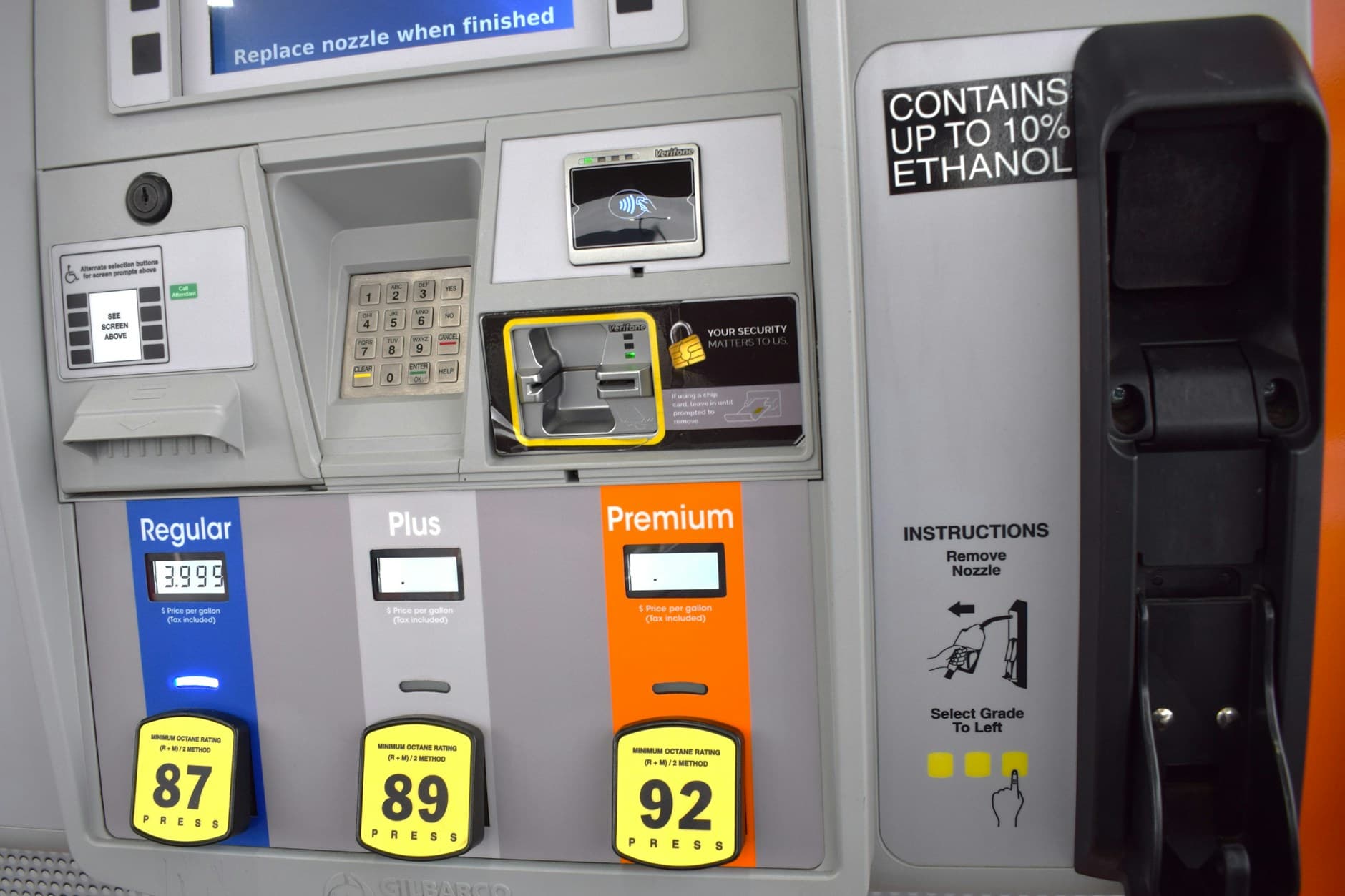 A gas pump displaying fuel prices near four dollars per gallon