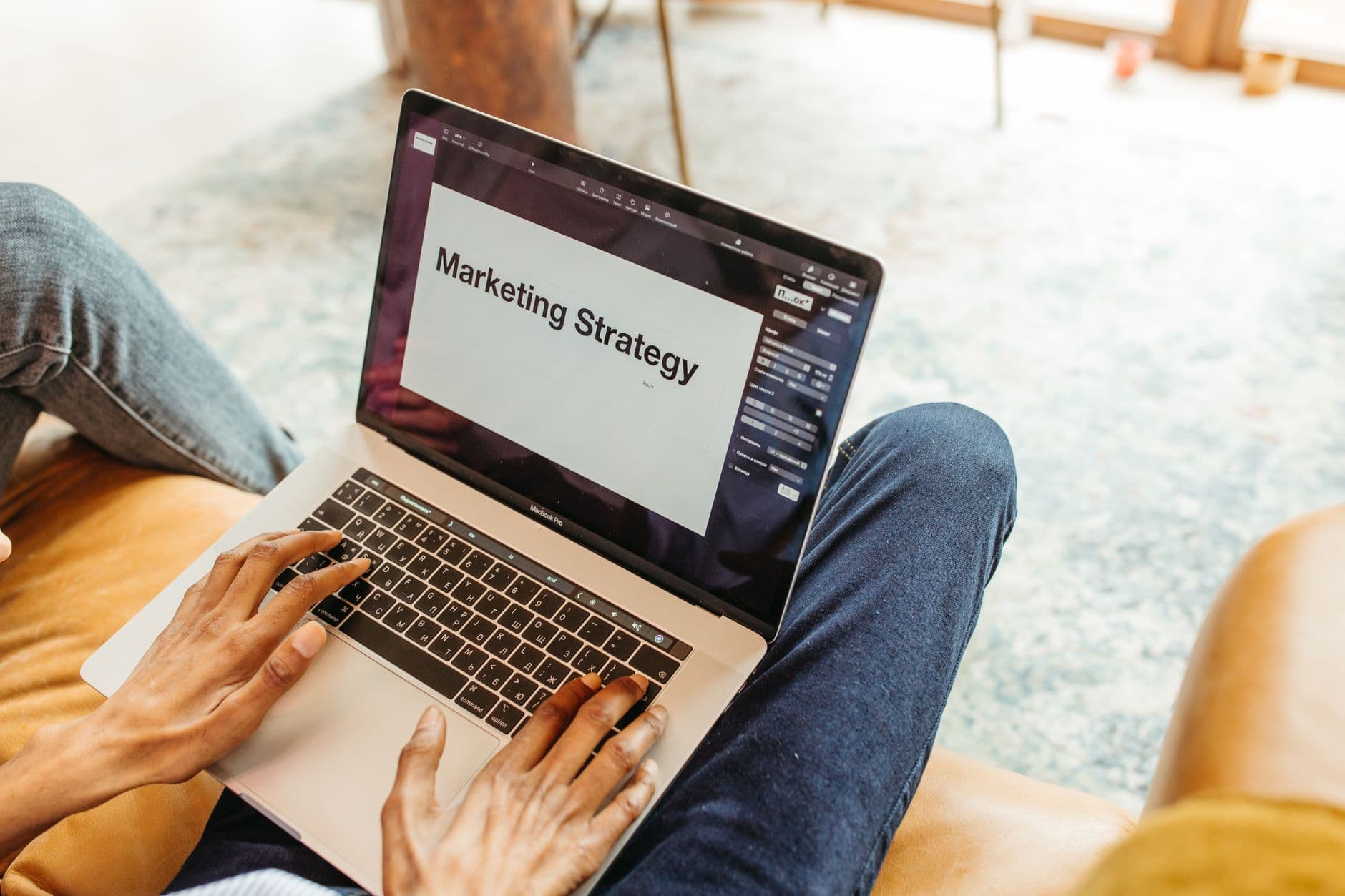 A small business seller reviewing an Etsy Ads campaign dashboard on a laptop