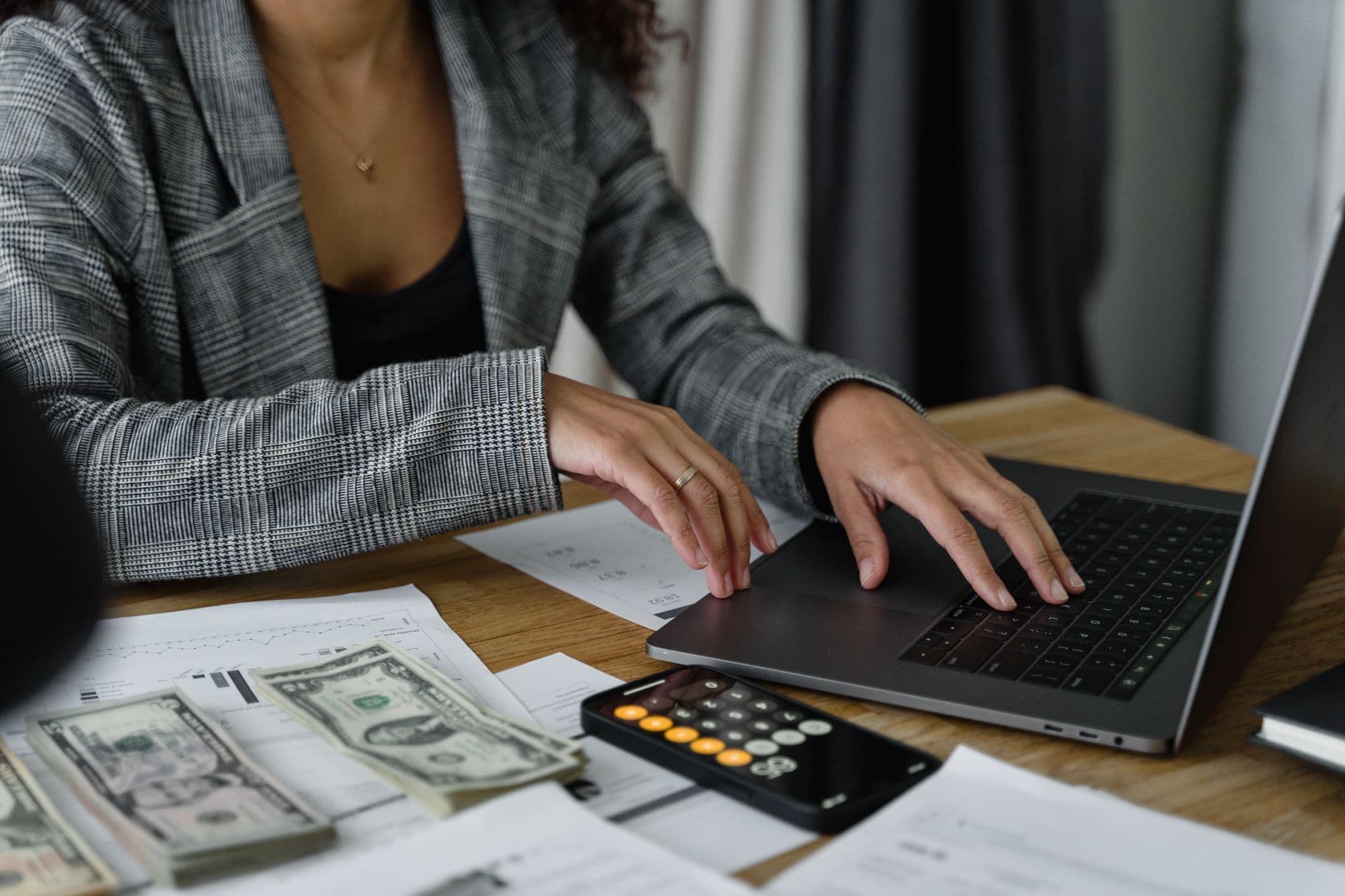 Small business owner reviewing accounting software on a laptop