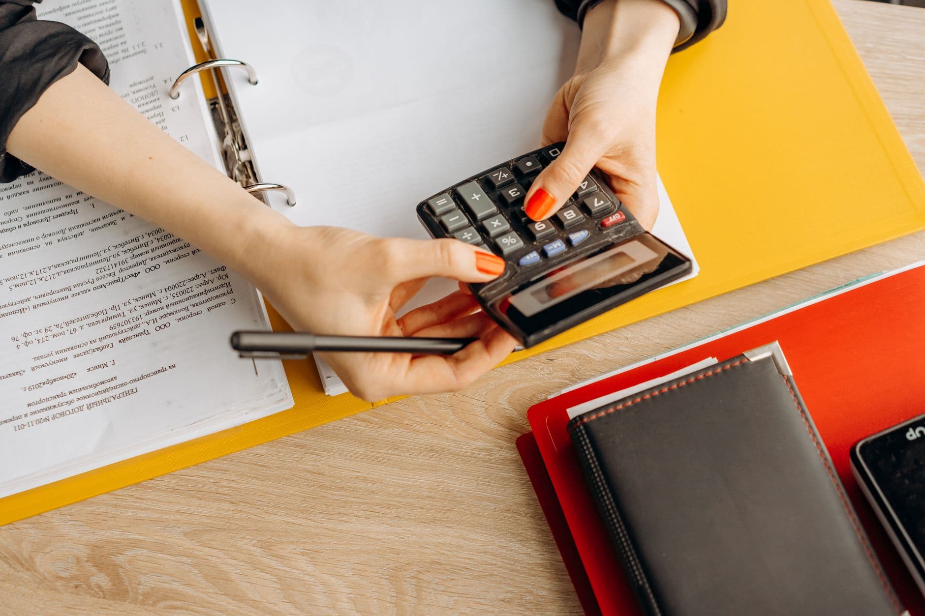 Small ecommerce seller reviewing bookkeeping records at a desk