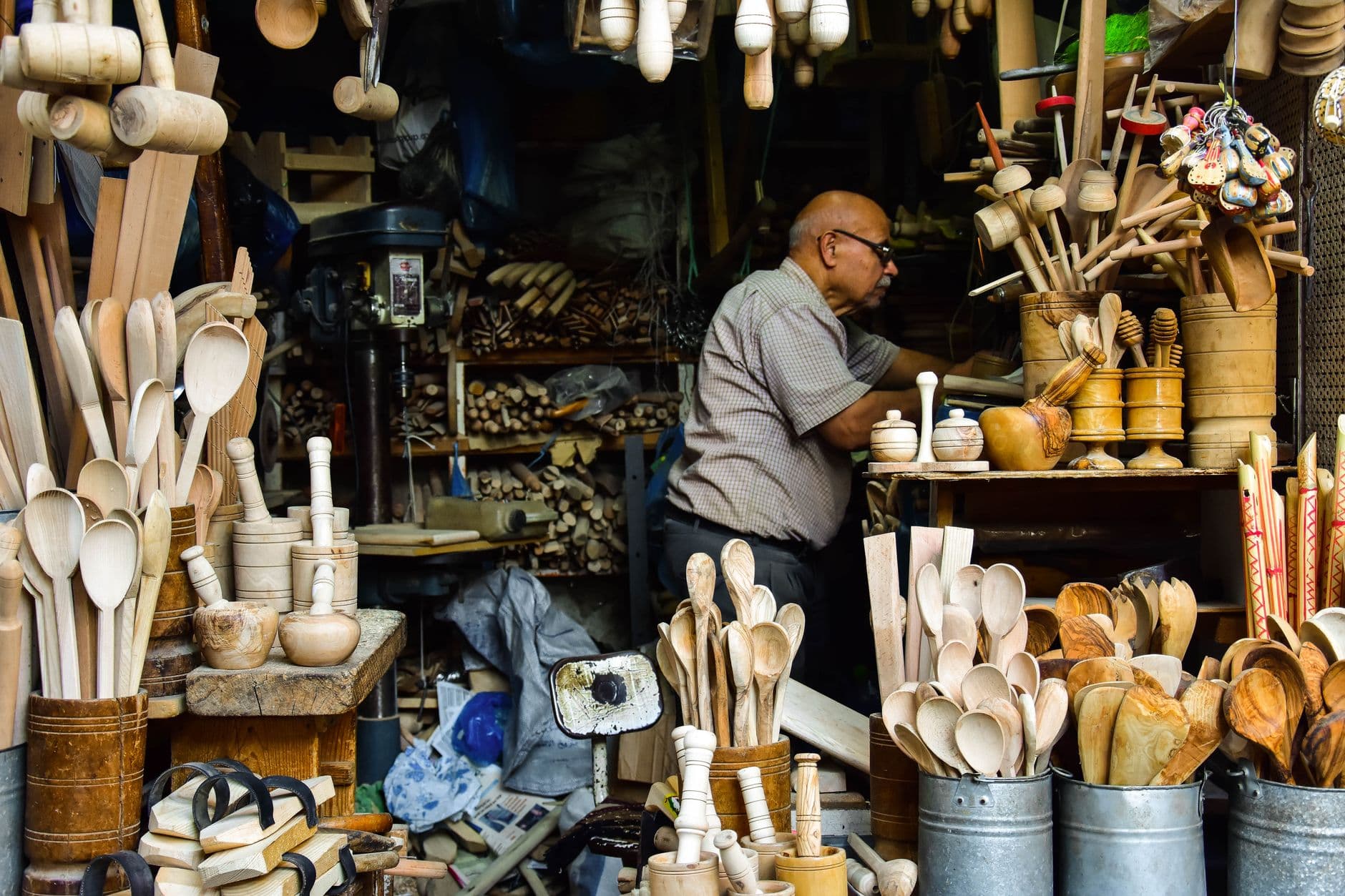 A craft seller packaging handmade goods at a small business workspace