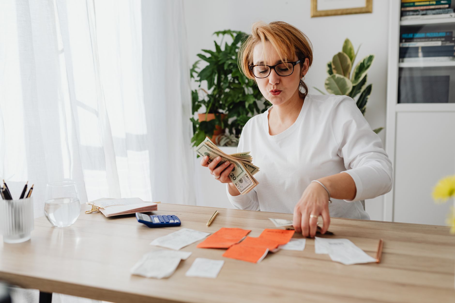Small business owner organizing receipts and financial documents